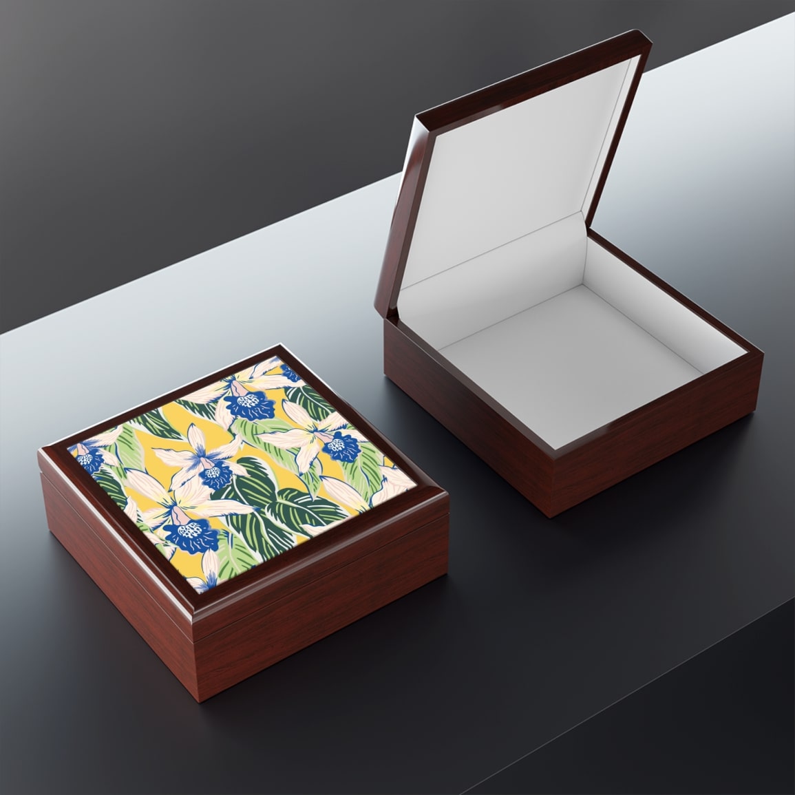 A mockup of a personalized jewelry box with abstract art on top.