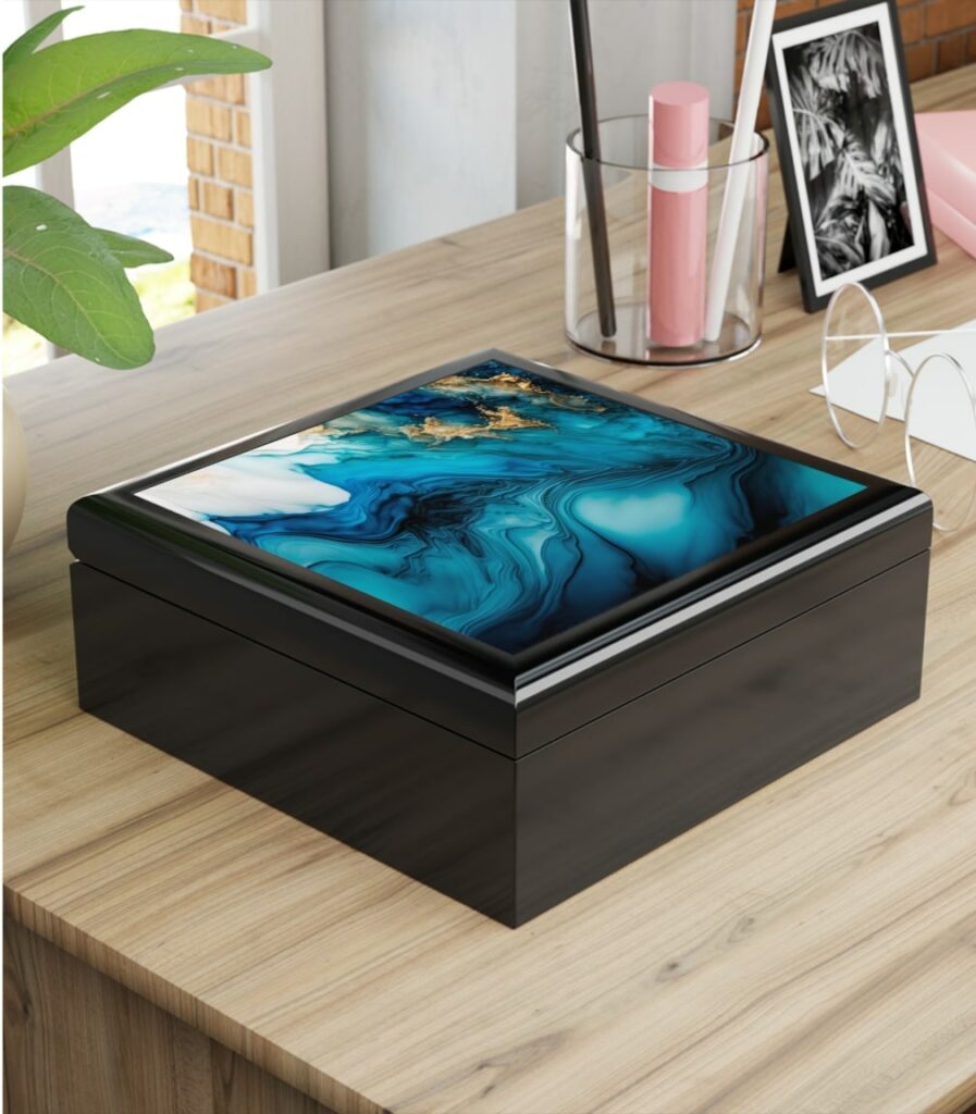 An image of a personalized jewelry box with an abstract picture on top.