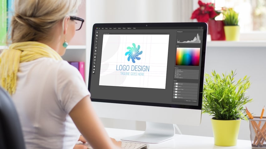 Woman designing her own t-shirt logo in Photoshop.