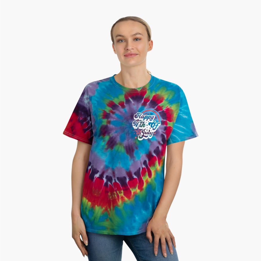 Model posing in a colorful spiral tie-dye shirt printed with the slogan “Happy 4th of July” on the upper right chest.