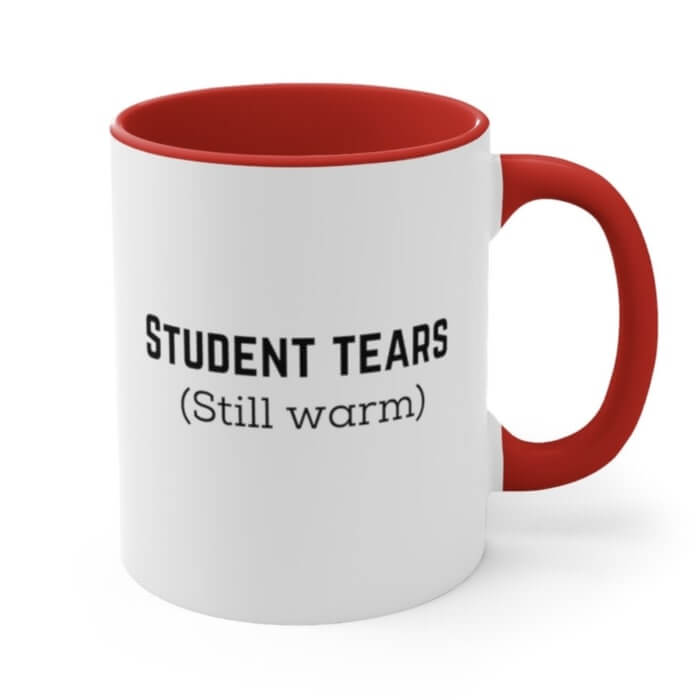 White mug with red inner accent and the text “Student tears (still warm).”