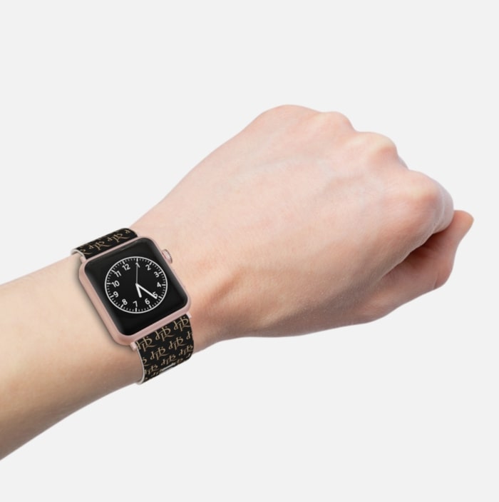 An image of a custom Apple Watch band with a signature pattern.
