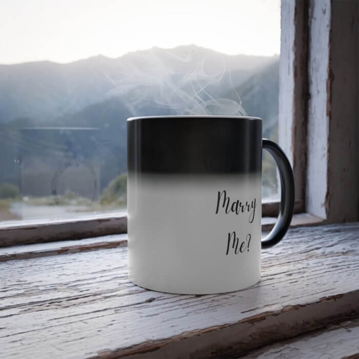Magic mug that reveals the text “Will you marry me?” when hot water is poured in.