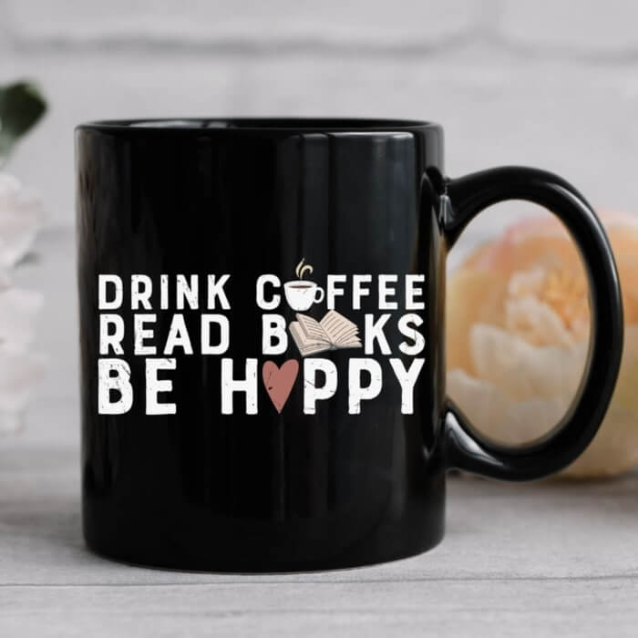 Black mug with the caption “Drink coffee, read books, be happy.”