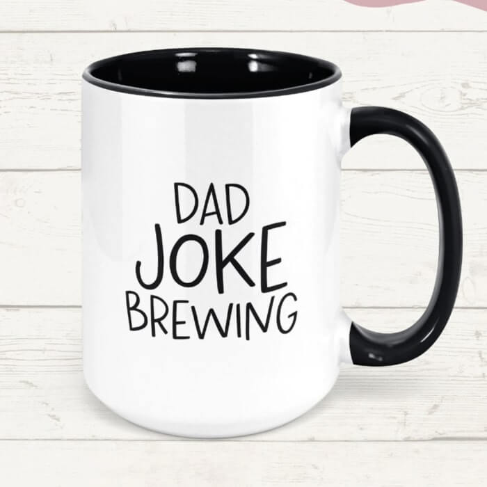 Black accent mug with the caption “Dad joke brewing.”