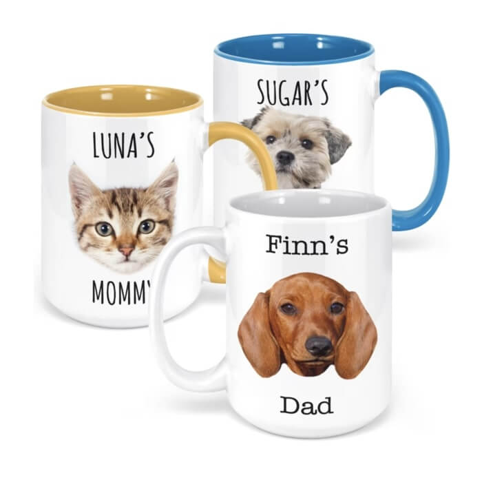 Three accent mugs with pictures of various pets' faces and captions like “Luna's Mommy” and “Finn's Dad.”