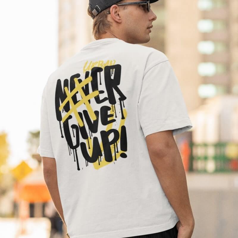 An image of a man wearing a white custom t-shirt with motivational text printed on the back.