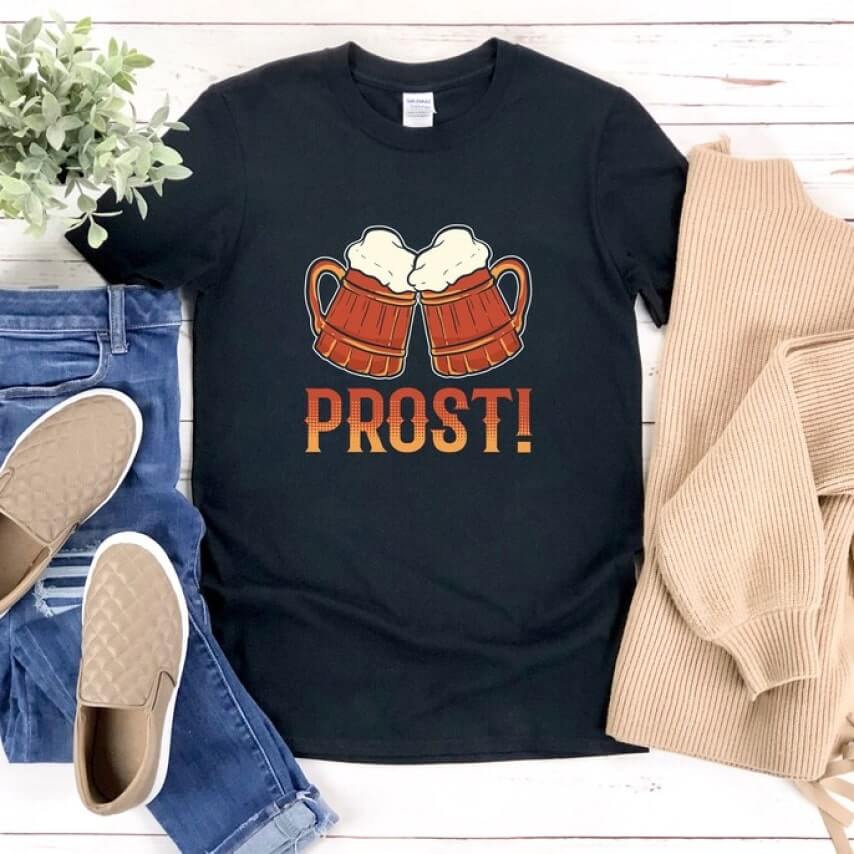 Black Oktoberfest t-shirt with a graphic of two beer mugs and the text “Prost!”