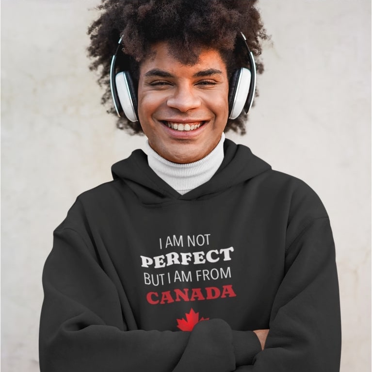 An image of a man wearing a custom hoodie in black with text about Canada.