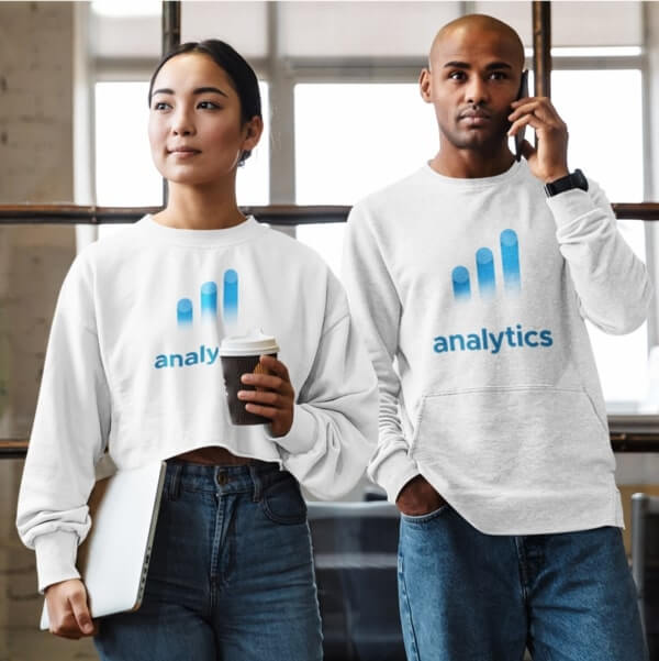 A man and a woman in matching white sweatshirts with custom logos of three blue lines and the company name “Analytics.”