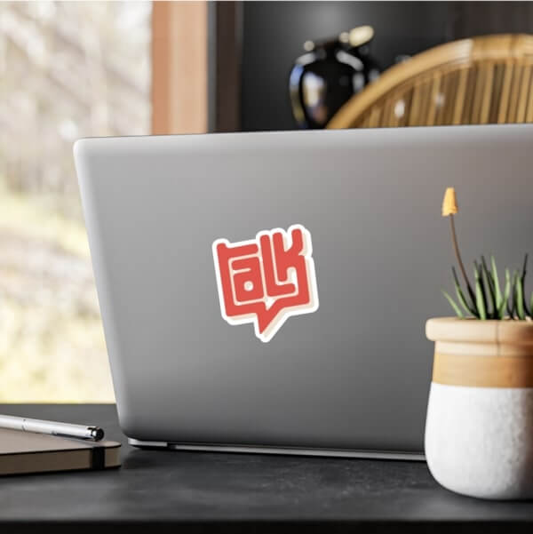 Red laptop sticker of a logo spelling out the word “Talk.”