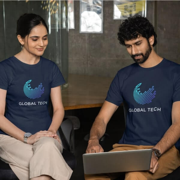 A man and a woman wearing blue custom logo merchandise t-shirts with the company name “Global Tech” underneath.