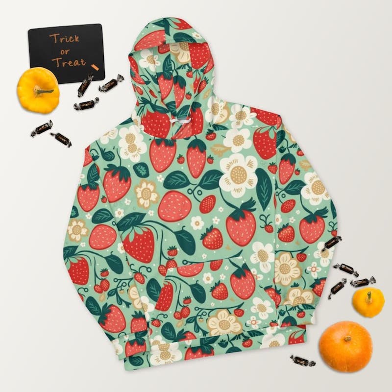 Mint green hoodie with an all-over-print design of strawberries and white flowers.