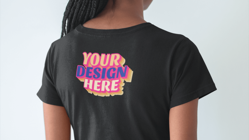 Woman wearing a black t-shirt with a “Your Design Here” placeholder on the back outer neck label print area.