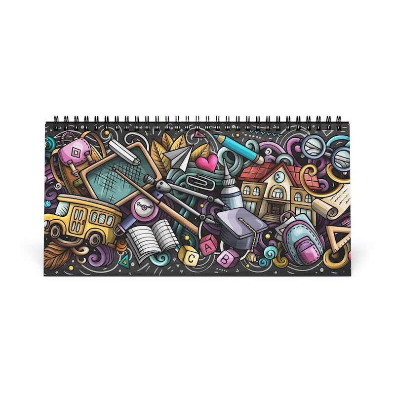 A desk calendar with a creative design – a colorful pattern of school supplies, symbols, and daily essentials.