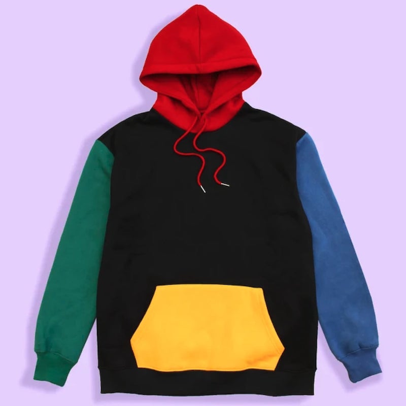 Color block hoodie with a black torso area, red hood, yellow front pocket, green right sleeve and a blue left sleeve.