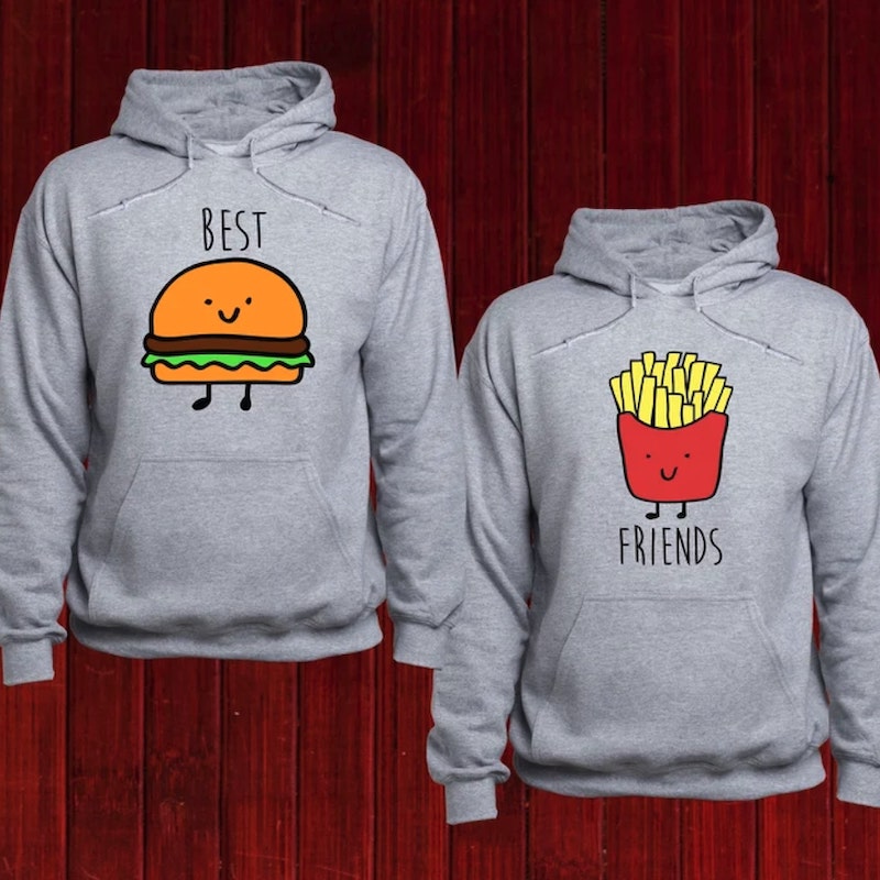 Gray hoodie with a cartoon hamburger and the text “Best” above it next to another gray hoodie with a cartoon packet of french fries and the text “Friends” above it.