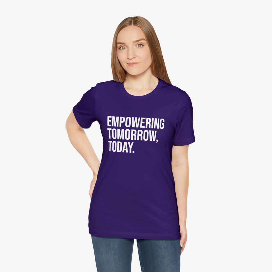 A woman wearing a purple custom t-shirt with text saying “Empowering Tomorrow, Today”.