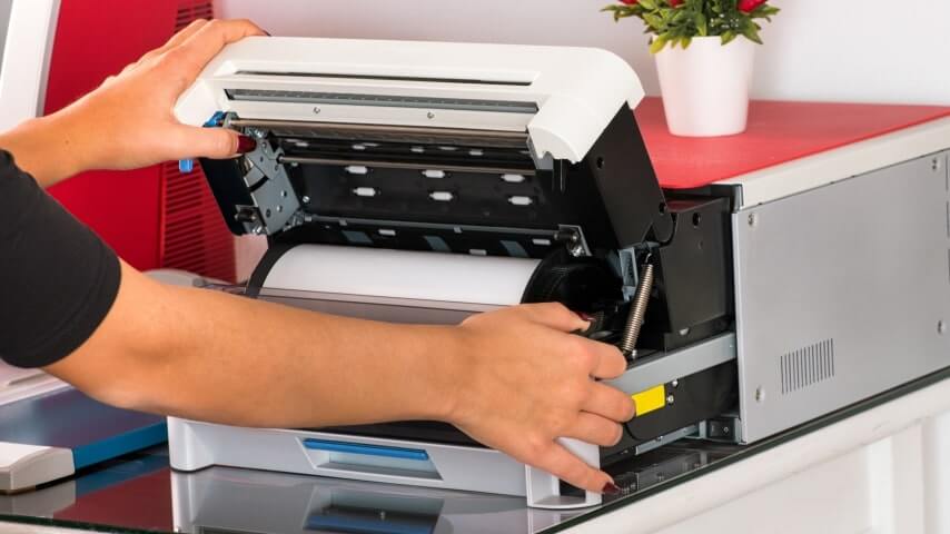 Person using a sublimation heat press machine at home.