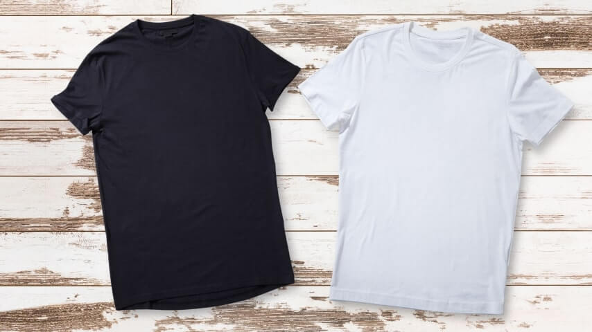 Black and white t-shirts placed next to one another.