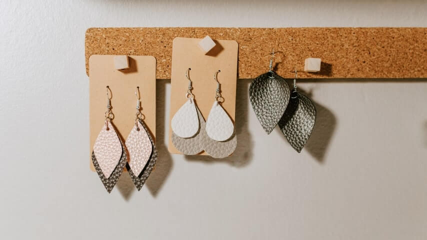 Handmade earrings displayed for sale in an online store.