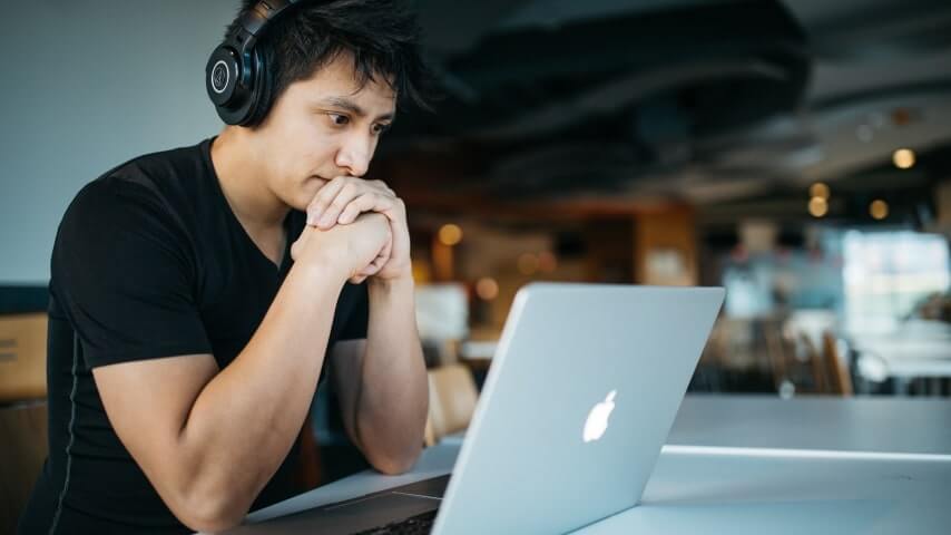 A man participating in an online class, representing the online education niche.