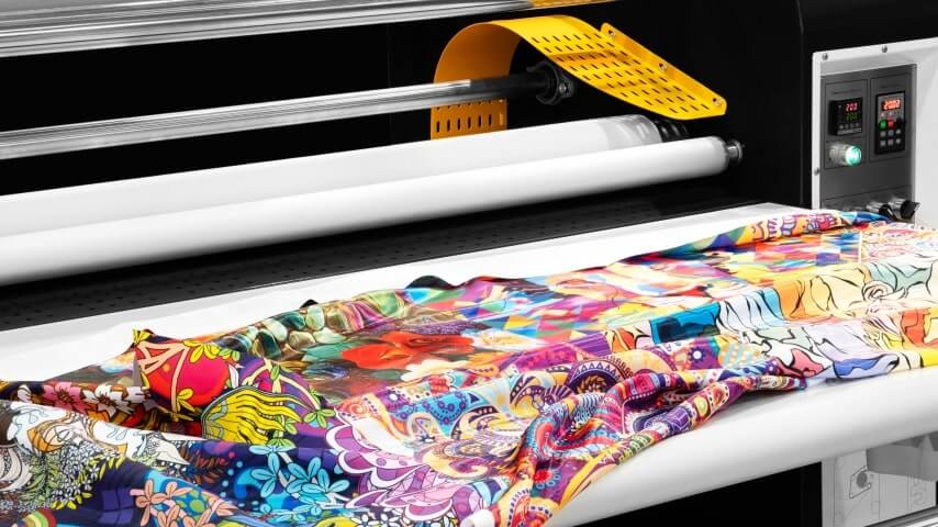 Print-on-demand sublimation printing facility with a large piece of sublimated fabric placed on a sublimation printer.