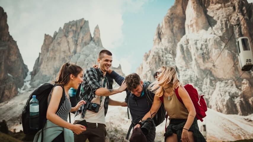 A group of friends hiking in the mountains, representing the tourism and travel niche.