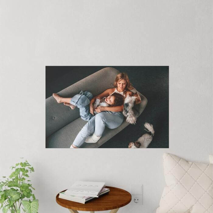 Horizontal poster of a photo of a woman and her child and two dogs.