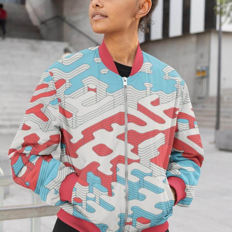 A girl wearing a customized bomber jacket with abstract graphics.