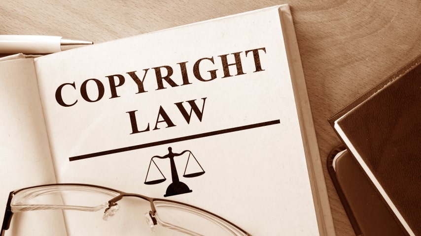 A book with “Copyright Law” written on the cover.