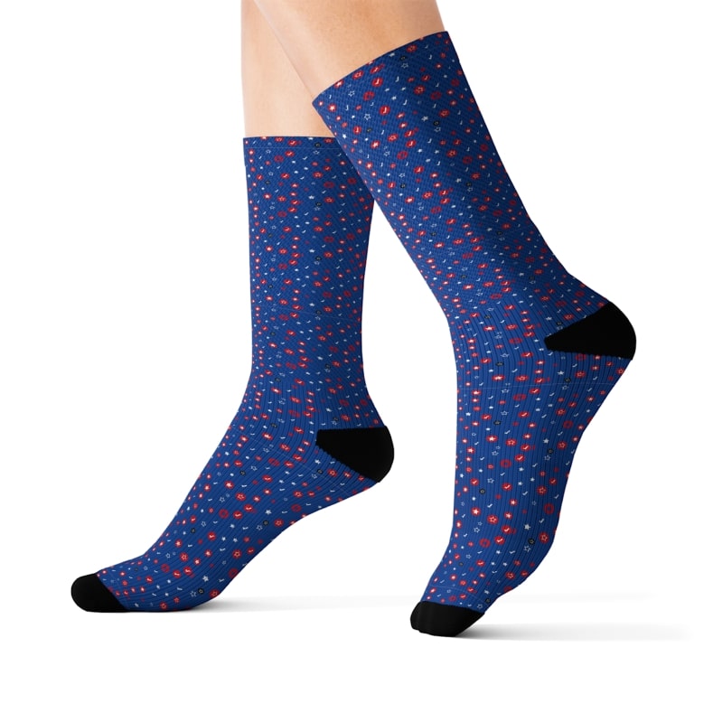 AOP sublimation socks from Printify's Catalog with a pattern of red symbols on a blue background.