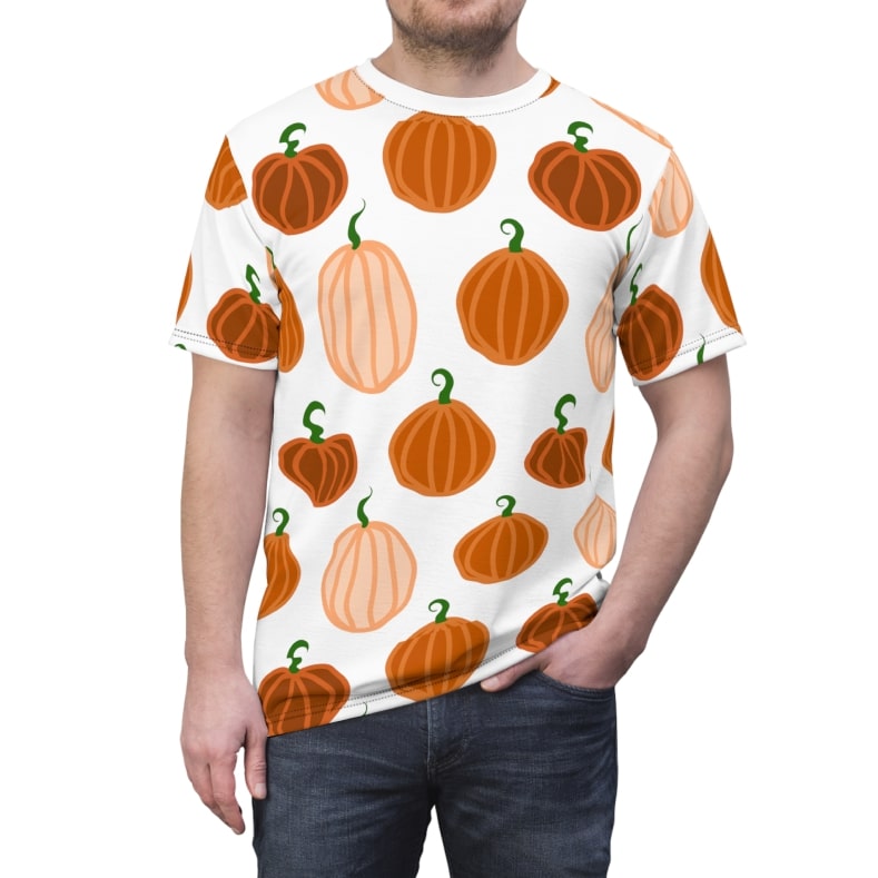AOP t-shirt from Printify's Catalog with a pattern of orange pumpkins printed all over.