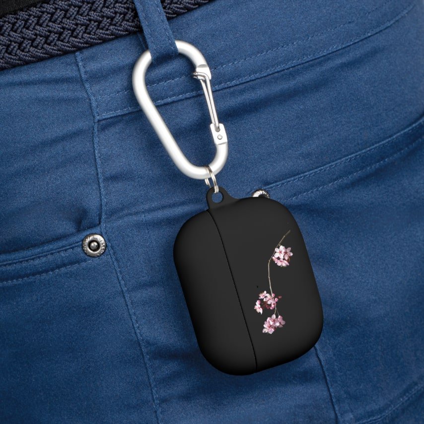 Black custom AirPod Case Cover with a design of a cherry blossom branch.