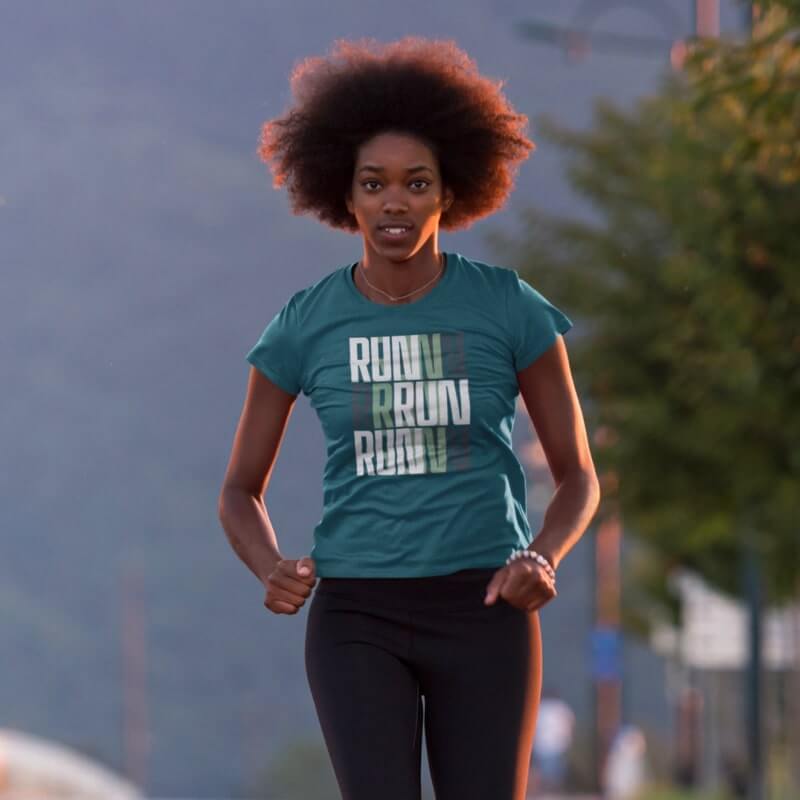 A woman participating in a fundraiser marathon and wearing a custom t-shirt that says, “Run, run, run.”