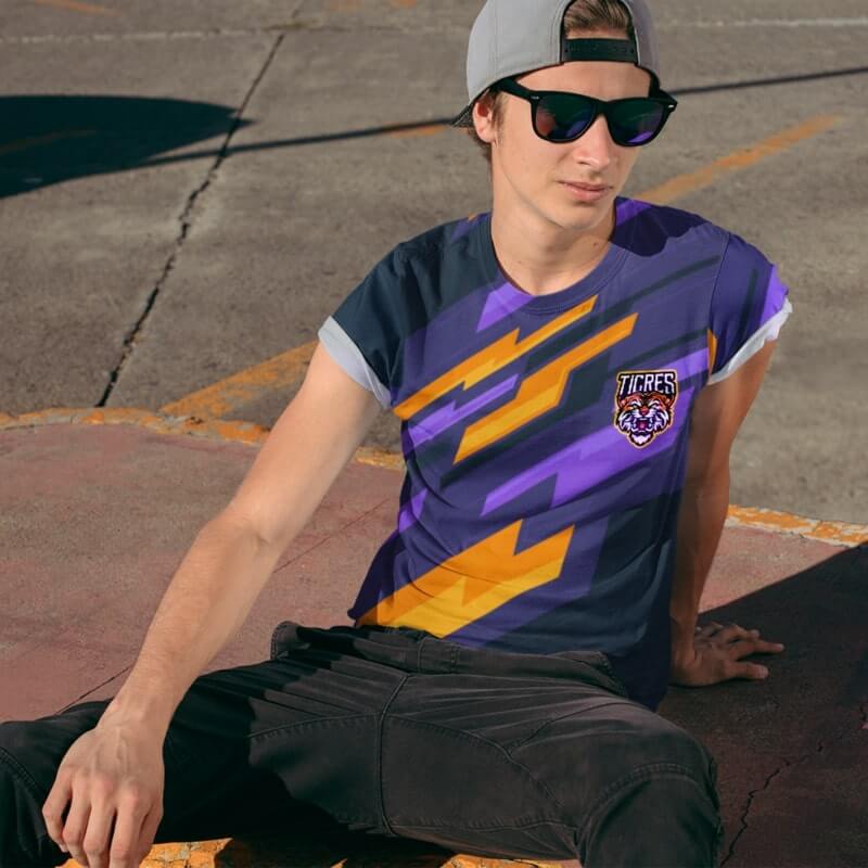 A young man wearing a custom all-over-print eSports jersey.
