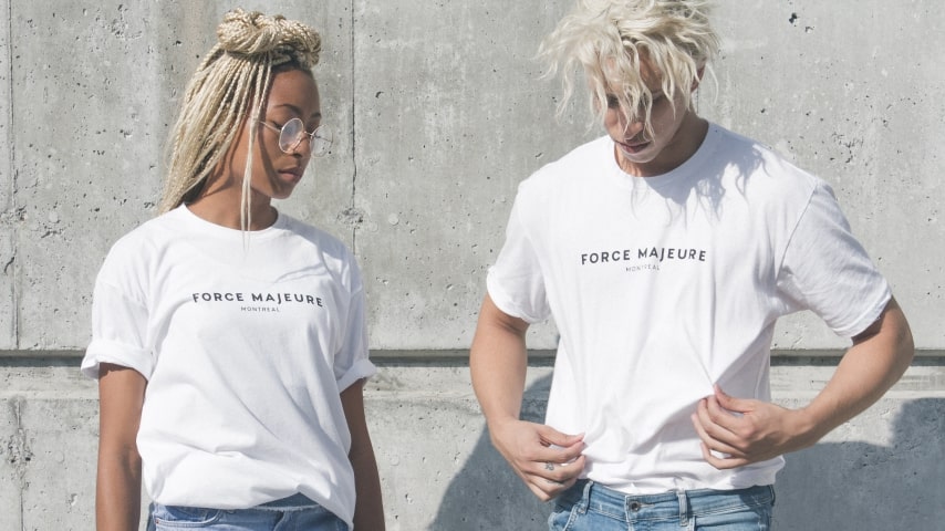 Two models wearing white branded t-shirts.
