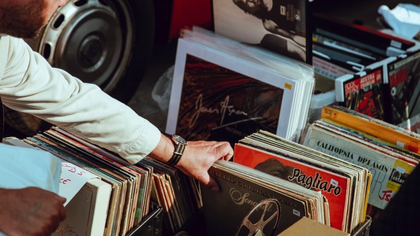 Hand reaching out for a vinyl.