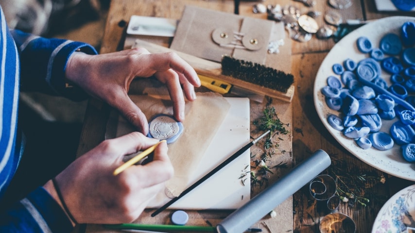 A person doing clay craft.