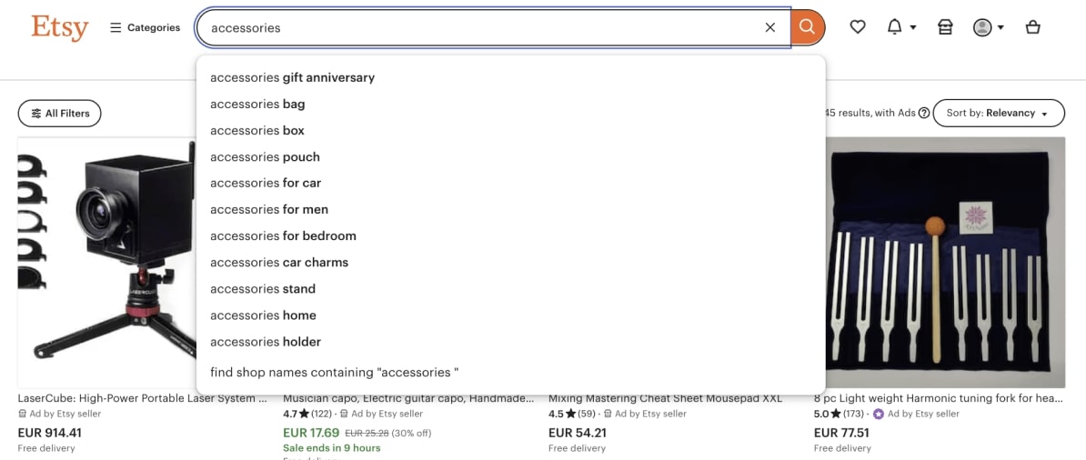 Etsy search example for the keyword “accessories” showing a dropdown of further keyword ideas such as “accessories bag” and “accessories box.”