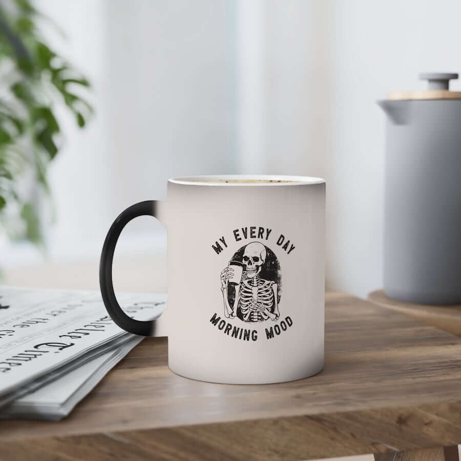 A color-changing mug with an illustration of a skeleton with the text: “My Every Day Morning Mood.”