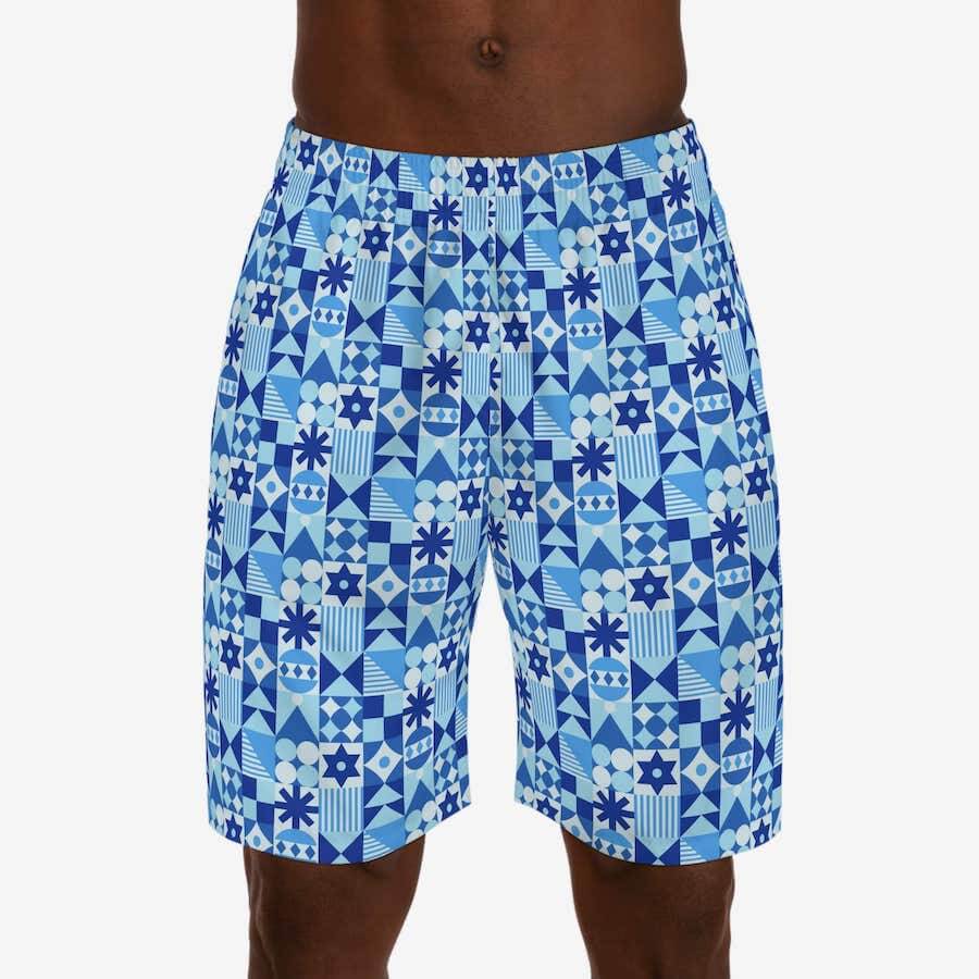 Jogger shorts with geometric shape patterns in various shades of blue.