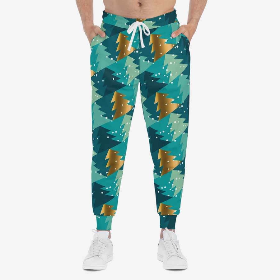 Jogger pants with stylized Christmas tree patterns in shades of green and gold.