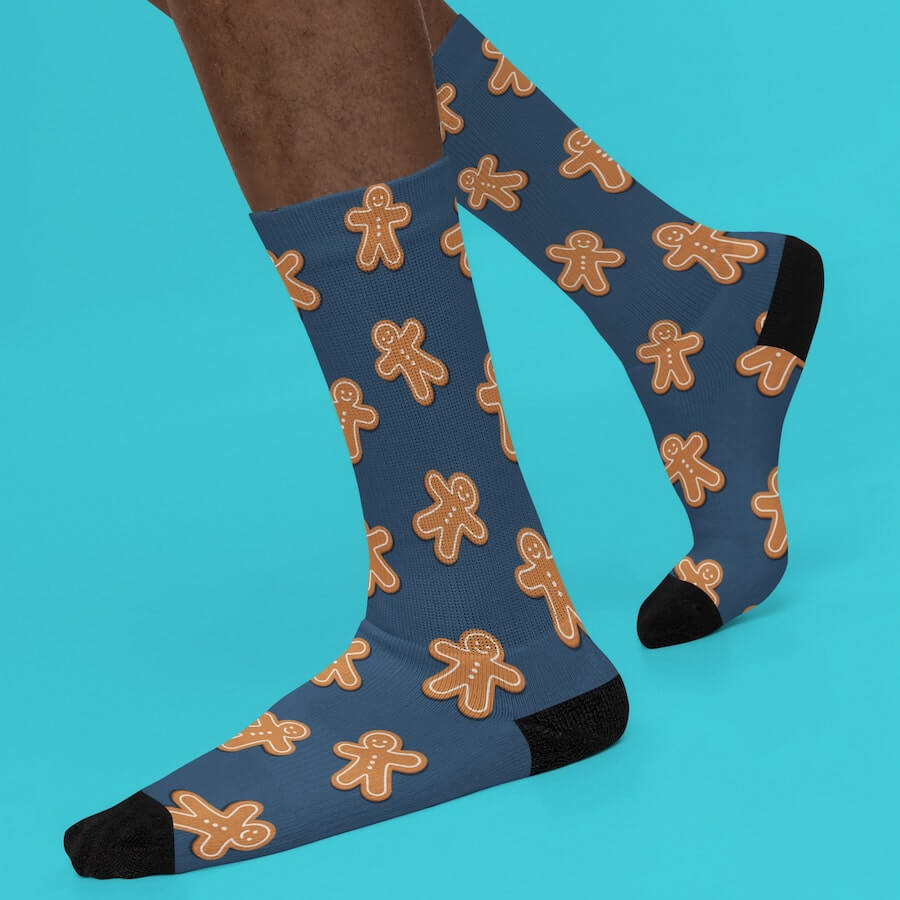 Dark blue socks with a stylized gingerbread man pattern.