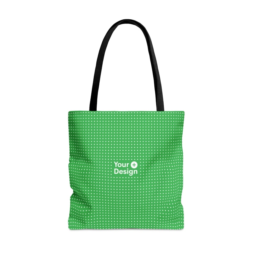 A green white-dotted tote bag with a black handle with the “Your Design+” logo.