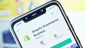 A person learning how to add products to Shopify via the Shopify app.