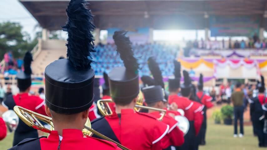 A marching band in matching uniforms.