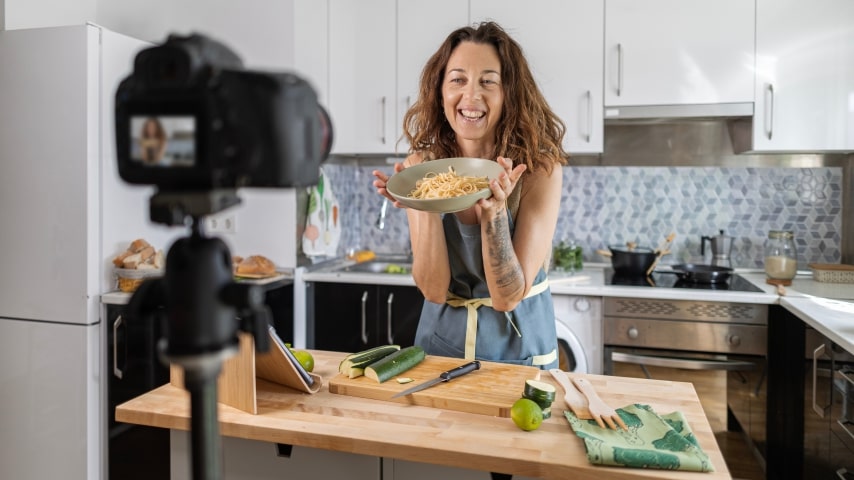 A woman creating video content for her health foods niche.