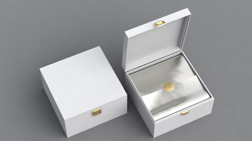 A white and gold custom-made jewelry box.
