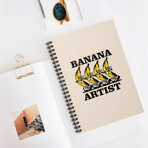 Custom spiral notebook with a banana illustration and text.